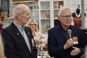 Chilliwack Hospice Society board member Bob Besner (right) speaks to audience with award recipient Vince Merritt at his side.
